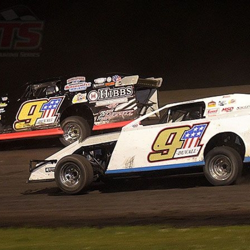 Joe Duvall (white car) races to the inside of his teammate and crew chief, Scott Drake, during the main event at the 7th Annual USMTS Malvern Bank Duals at the Adams County Speedway in Corning, Iowa, on Saturday, June 10, 2017.