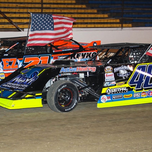 Brett Dutenhoffer (48) and Jacob Bleess (21) share the front row for the start of the main event at the 3rd Annual RHRSwag.com Summersota Modified Nationals at the I-94 Speedway in Fergus Falls, Minn., on Friday, May 19, 2017.